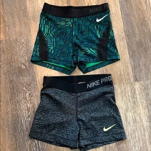 Two pairs of Nike Pro Spandex, both size small.